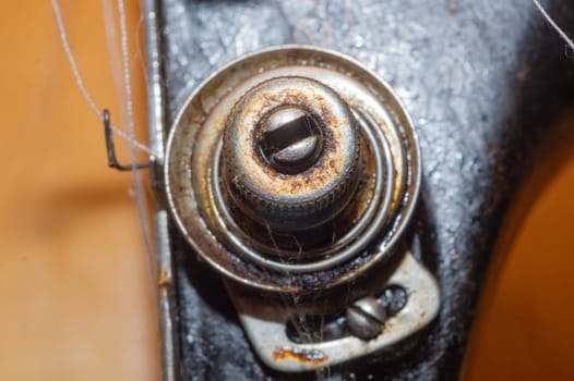 Detail of old sewing machine close up. rusted mechanism macro