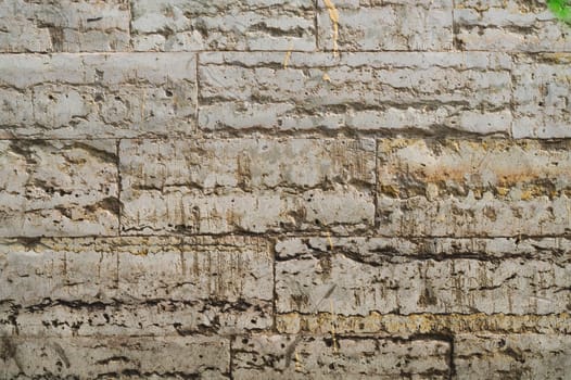 Rough wall of ancient house. uneven background