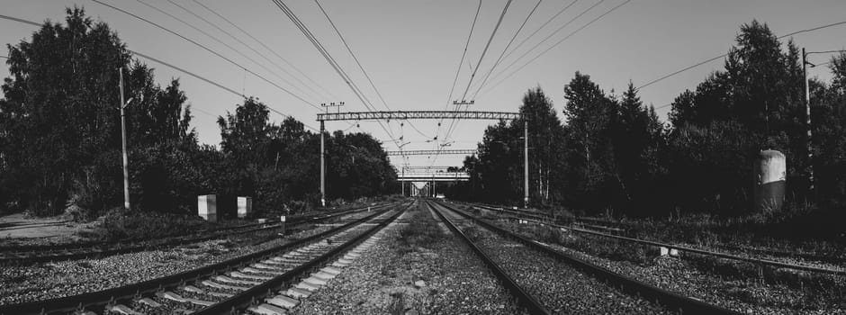 Railroad tracks perspective view black and white. steel rails go into the distance
