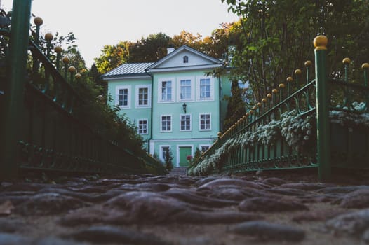 Manor house low angle view. lonely mansion across the garden