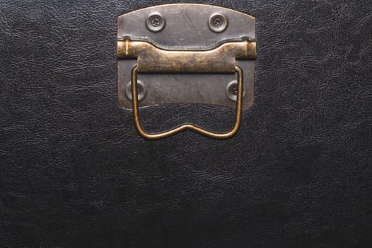 Metal handle with black leather background