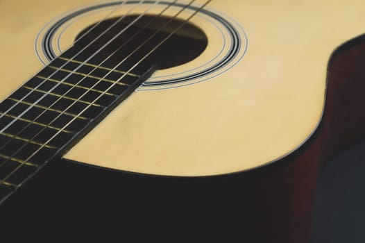 Acoustic guitar close up. musical instrument. strings on the guitar neck