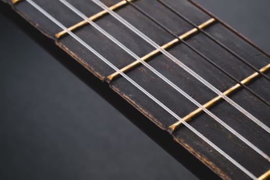 Acoustic guitar neck close up. guitar strings macro. musical instrument