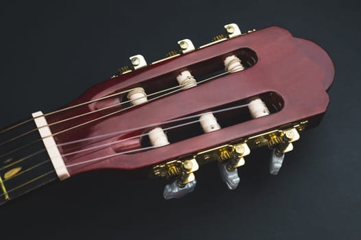 Guitar headstock close up. acoustic musical instrument