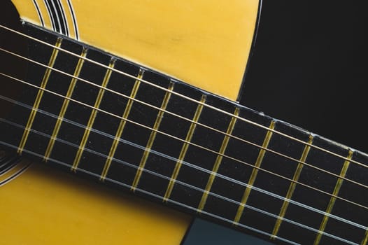Acoustic guitar neck close up. guitar strings macro. musical instrument
