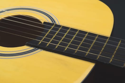 Guitar close up. acoustic musical instrument. strings on the guitar neck