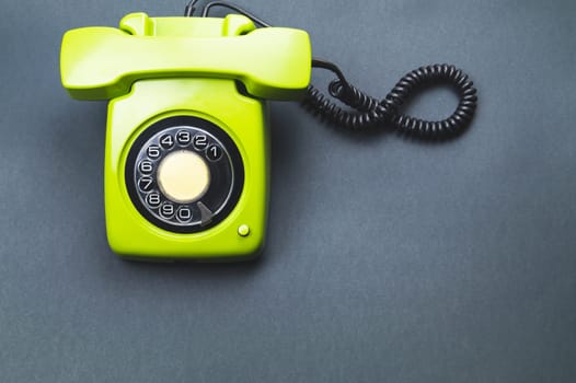 Classic phone with handset. vintage green telephone with phone receiver. office background. old communication technology. copy space