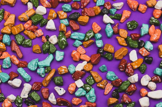 Candy pebbles background. sweets in the form of colorful stones