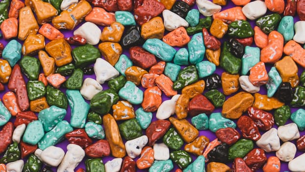 Candy pebbles background. sweets in the form of colorful stones