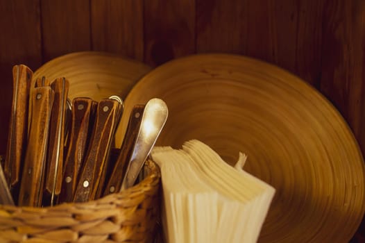 Cutlery and wooden plates. old fashioned utensil