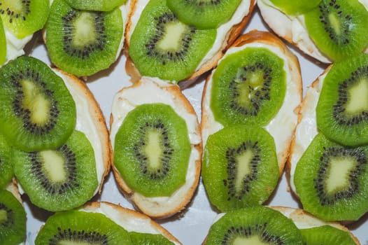 Sandwiches with kiwi. bread with fruit slices. background with appetizer