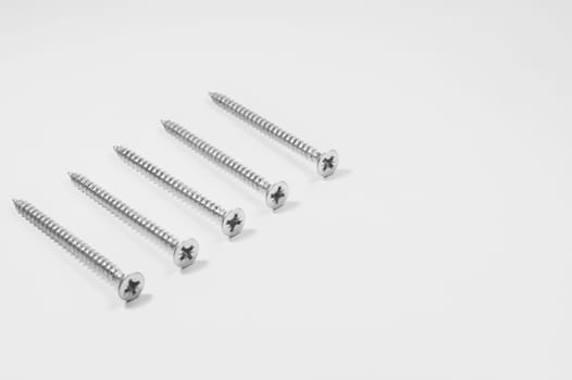 Steel screw on a white background. working tools