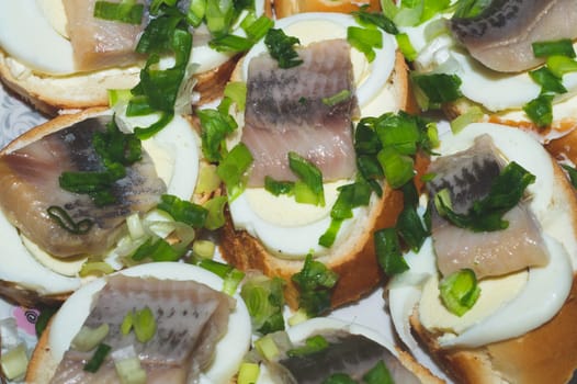Sandwiches with herring fillet. traditional food. appetizer with fish