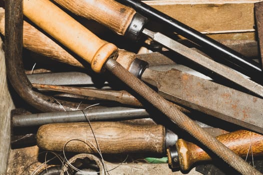 Pile of the old rasps. different carpentry files. various graters. instrument for wood processing. hand tools