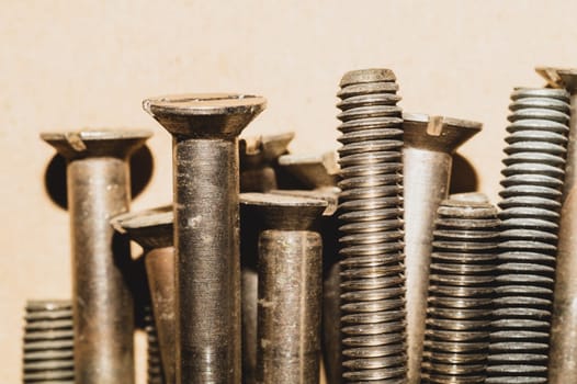 Screws on the table close up. work tool