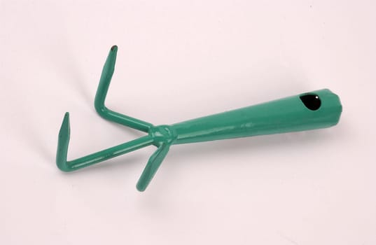Rake - hand tool on a white background