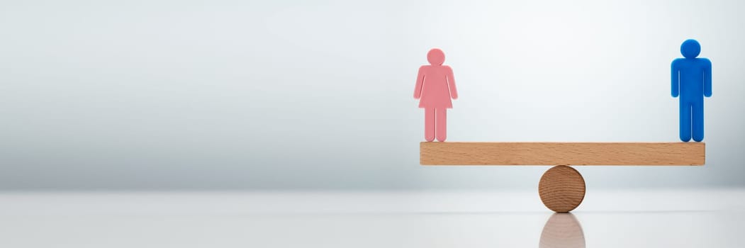 Gender Equality Concept. Male And Female Balancing On Seesaw