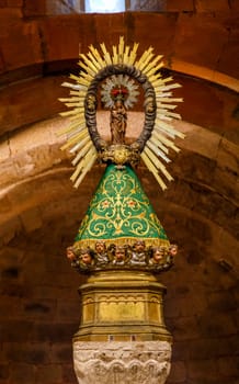 Veruela, Spain - October 7, 2021: In the main chapel we find the polychrome wooden image of Our Lady of Veruela. The first Virgin canonically crowned in Spain
