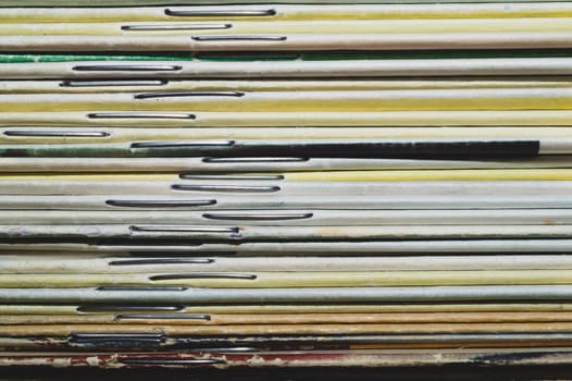 Stack of old magazines. pile of retro newspapers. vintage journals lie on top of each other