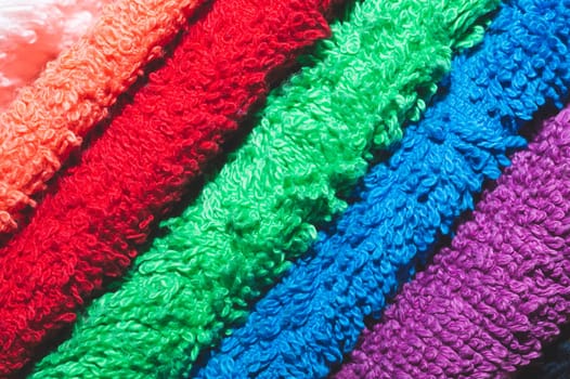 Different colorful towels close up