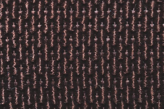 Brown fabric texture. knitted textile close up. woven background