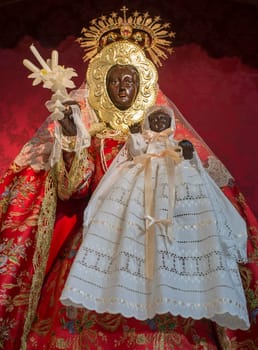 Caceres, Spain - Jan 14th, 2021: Our Lady of Guadalupe del Vaquero figure. Church of Santiago, Caceres, Extremadura, Spain