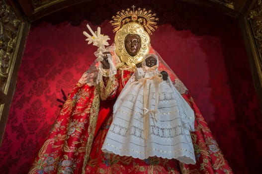 Caceres, Spain - Jan 14th, 2021: Our Lady of Guadalupe del Vaquero figure. Church of Santiago, Caceres, Extremadura, Spain