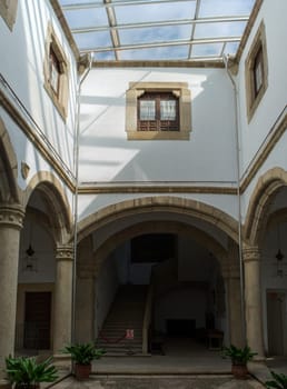 Caceres, Spain - Jan 14th, 2021: Palace of Carvajal rectangular cloister. Caceres, Extremadura, Spain