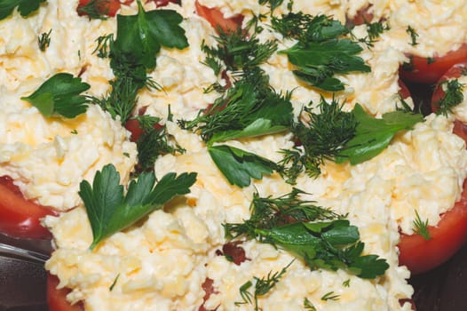 Tomato with cheese and parsley. appetizer from vegetables. halves of tomatoes with grated cheese