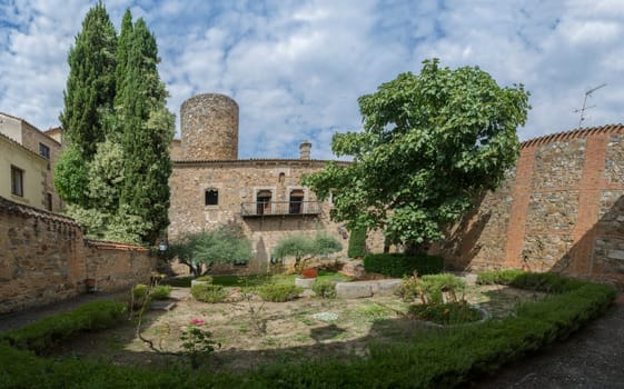 Caceres, Spain - Oct 1st, 2021: Palace of Carvajal garden. One of the most emblematic building of monumental Complex of Caceres, Extremadura, Spain