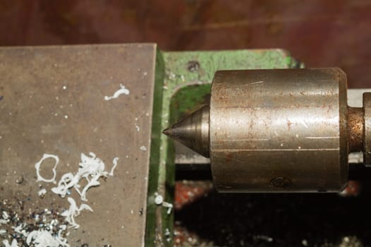 Old lathe. detail of rusty machine. metal mechanism. vintage metalworking machine close up. abstract industrial background