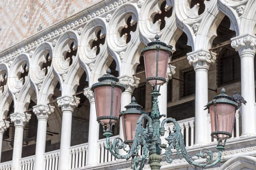 Old street lamp in Venice against the Doge's Palace in the background. Venice. Italy. Horizontally.
