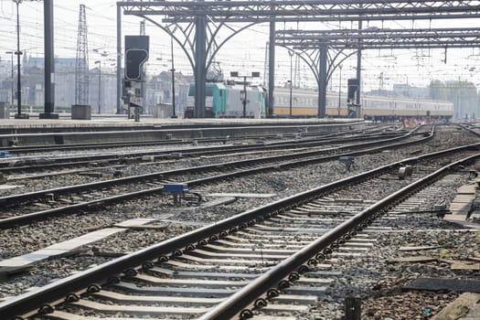Rail tracks and trains in the Brussels South Railway Station