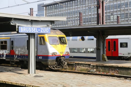 Rail tracks and trains in the Brussels South Railway Station