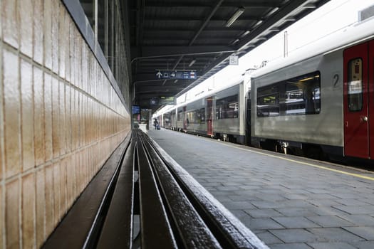 Rail tracks and trains in the Brussels South Railway Station