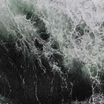 Big water splash seen from above a boat