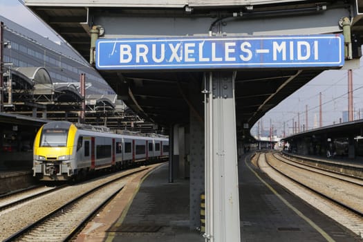 Rail tracks and trains in the Brussels South Railway Station