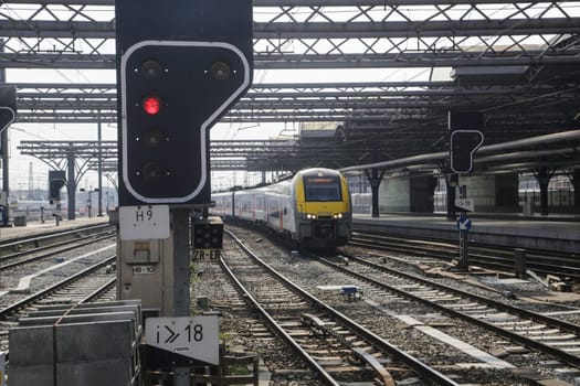 Rail tracks and trains in the Brussels South Railway Station