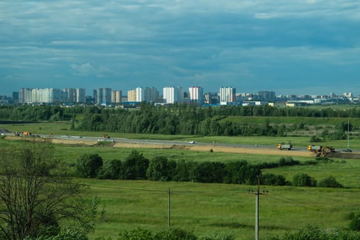 Urban cityscape panoramic view. horizon line with buildings. nature landscape with town and forest. blue sky. city into a distance