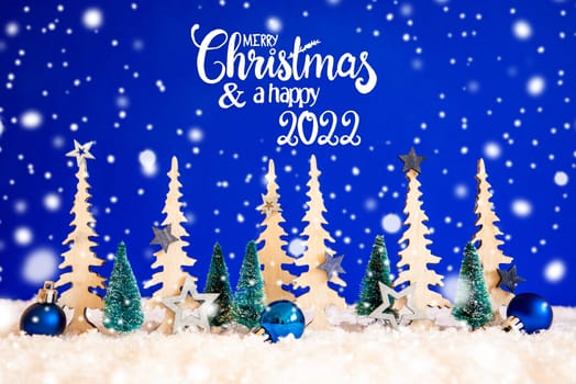 Christmas Trees With English Text Merry Christmas And Happy 2022. Christmas Decoration Like Blue Star Ornament And Balls. Blue Background With Snow And Snowflakes.