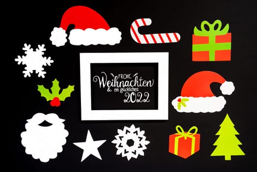 Frame With German Text Frohe Weihnachten Und Ein Glueckliches 2022 Means Merry Christmas And A Happy 2022. Paper Christmas Decoration Like Santa Hat, Gift, Snowflake, Star. Black Background