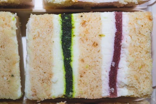 Cakes with jelly and souffle filling. sweet pastries. confectionery close up