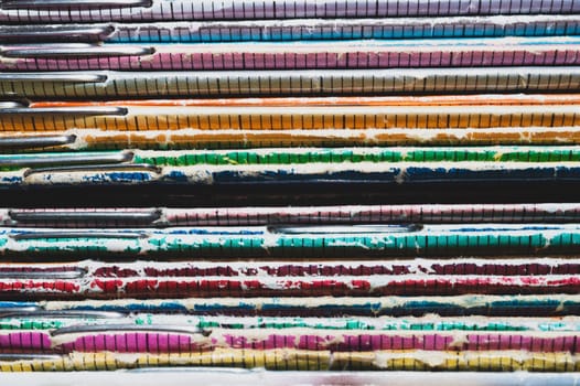 Stack of old magazines. pile of retro newspapers. vintage journals lie on top of each other. colorful background from the printed publications