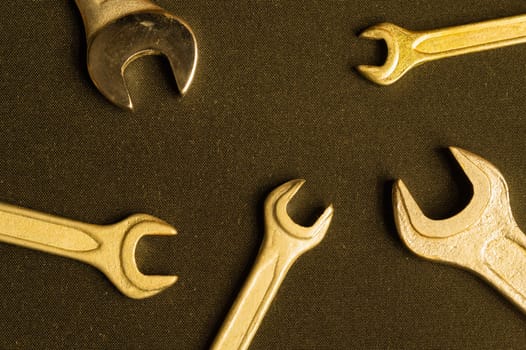 Different wrenches on a black background with copy space. working tool