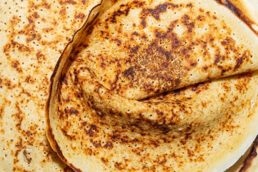 Thin pancakes close up background