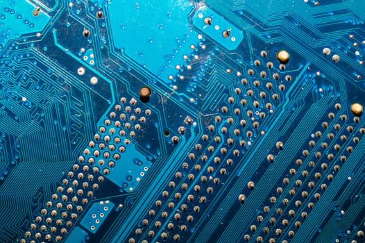 Dusty circuit board abstract background. computer motherboard close up. modern technologies. micro elements of computer with connections and traces. Intelligent technology