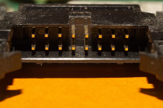 Power socket on motherboard. connector on the circuit board of computer close up. adapter pins macro