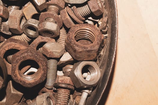 Old screws in a box. a lot of various screws. pile of fasteners in the box close up. carpentry workshop. work tool