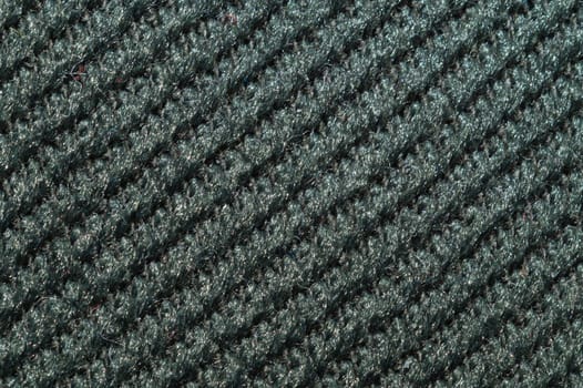 Black fabric texture. knitted textile background. woven material close up. knitting from wool yarn