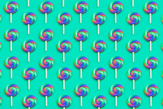 Lollipops are in a row. spiral candy pattern. lots of sweets on a turquoise background. festive decoration with candies
